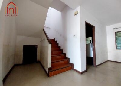 Staircase area with tiles and natural light