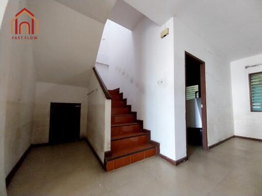 Staircase area with tiles and natural light