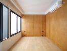 empty modern bedroom with wooden walls and floor