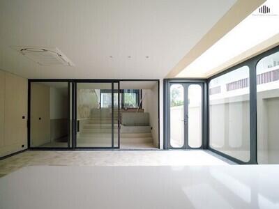 Modern living room with large glass doors and stairs