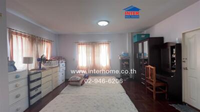 Spacious bedroom with ample storage and natural light