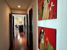 Hallway with wooden floor and colorful paintings