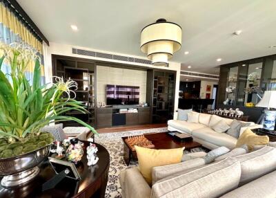 Spacious and modern living room with plush seating and large windows