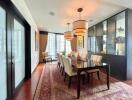 Elegant dining room with glass doors and modern lighting