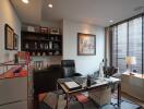 Spacious and well-lit home office with desk, chairs, and shelves