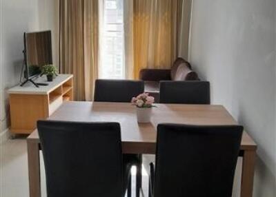 Modern living room with dining table and TV