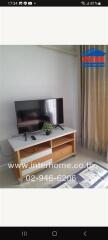 Living room with TV and wooden stand