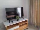 Living room with TV and wooden stand