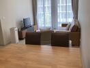 Living room with dining area and large window