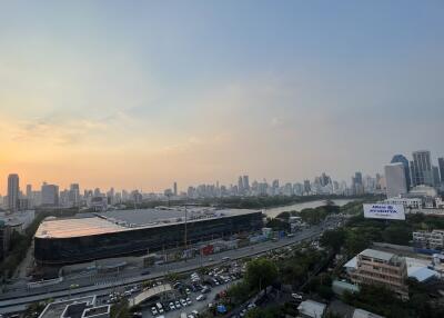 Panoramic view of a city skyline at sunset