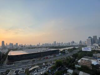 Panoramic view of a city skyline at sunset