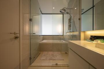 Modern bathroom with glass shower and bathtub