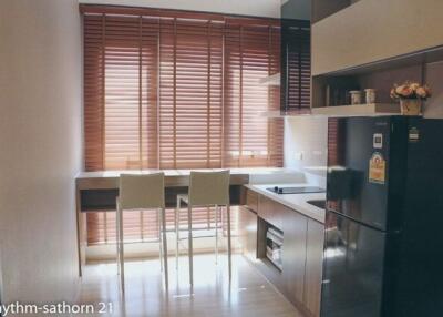 Modern kitchen with large window and contemporary furnishings