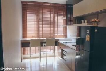 Modern kitchen with large window and contemporary furnishings