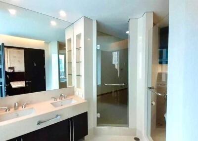 Modern bathroom with double sink and shower