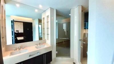 Modern bathroom with double sink and shower