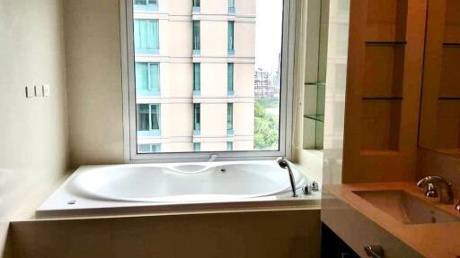 Bathroom with tub and window