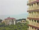 View of residential apartment buildings and surrounding greenery