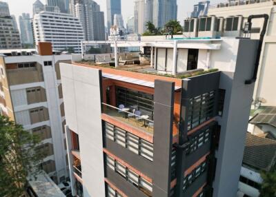 Modern apartment building with rooftop terrace