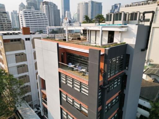 Modern apartment building with rooftop terrace