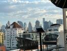 City view from a balcony with outdoor furniture