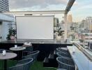 Rooftop area with seating and city view