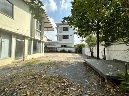 Backyard with view of neighboring buildings