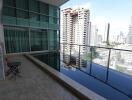 Balcony with pool and city view