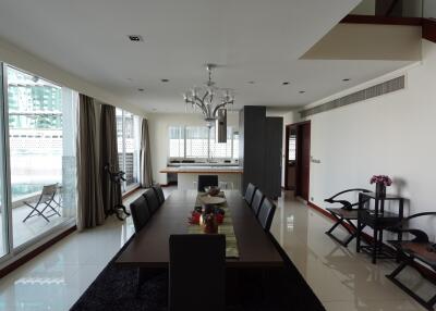 Spacious dining area with modern decor and large windows