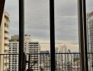 Living room with large windows and city view