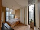 Modern bedroom with large windows and city view