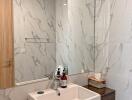 Modern bathroom with large marble tiles and a stylish sink