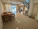 Modern living room with dining area and staircase