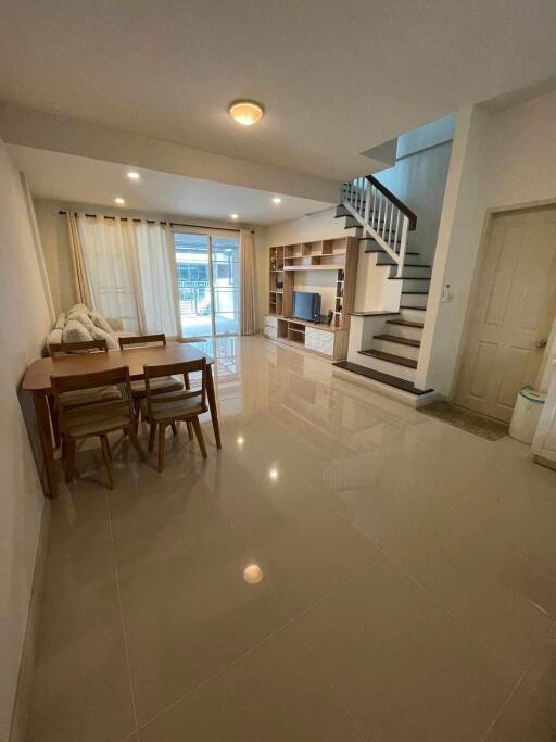 Modern living room with dining area and staircase