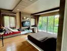 Modern bedroom with wooden flooring, large windows, and balcony view