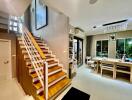 Living area with staircase and dining table