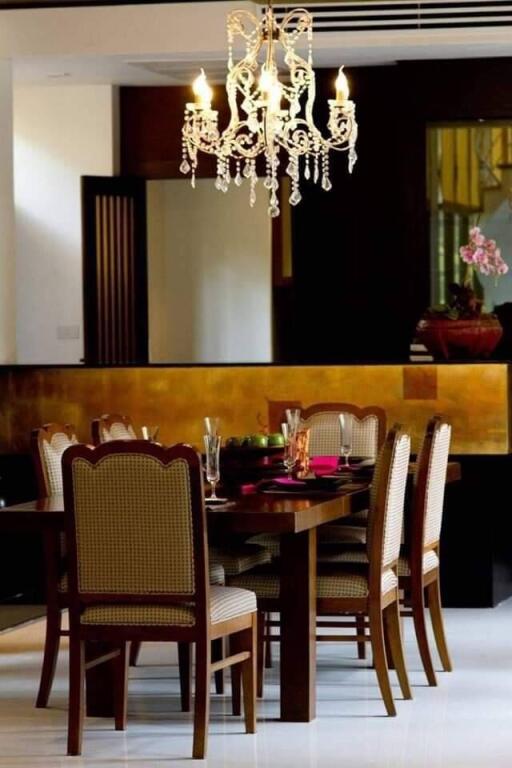 Elegant dining room with a chandelier and large wooden table