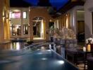 Luxurious outdoor space with pool and decorative fountains