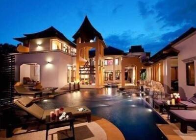 Luxurious villa with pool at dusk