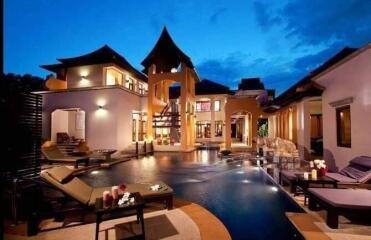 Luxurious villa with pool at dusk