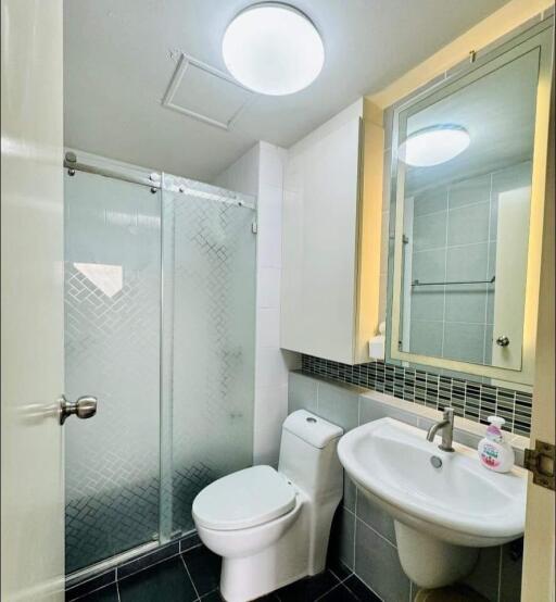 modern bathroom with shower and vanity area