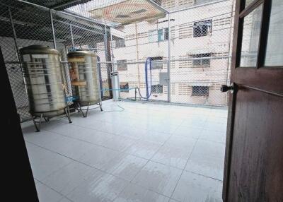 Enclosed outdoor area with water tanks