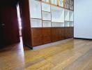 Spacious living room with built-in wooden shelving unit