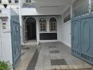 Front entrance with gated driveway