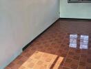 Empty bedroom with tiled floor and windows