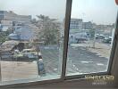 View from window overlooking buildings and trees