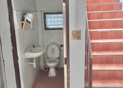 Small bathroom next to stairwell