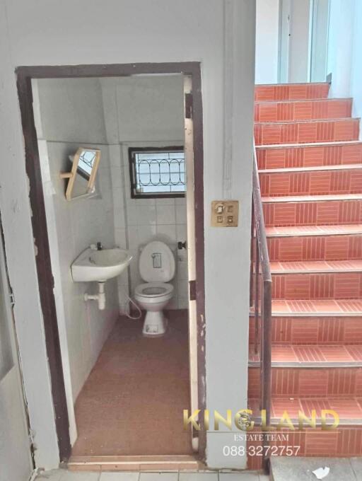 Small bathroom next to stairwell