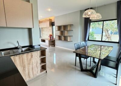 Modern kitchen and dining area with large window