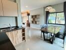 Modern kitchen and dining area with large window